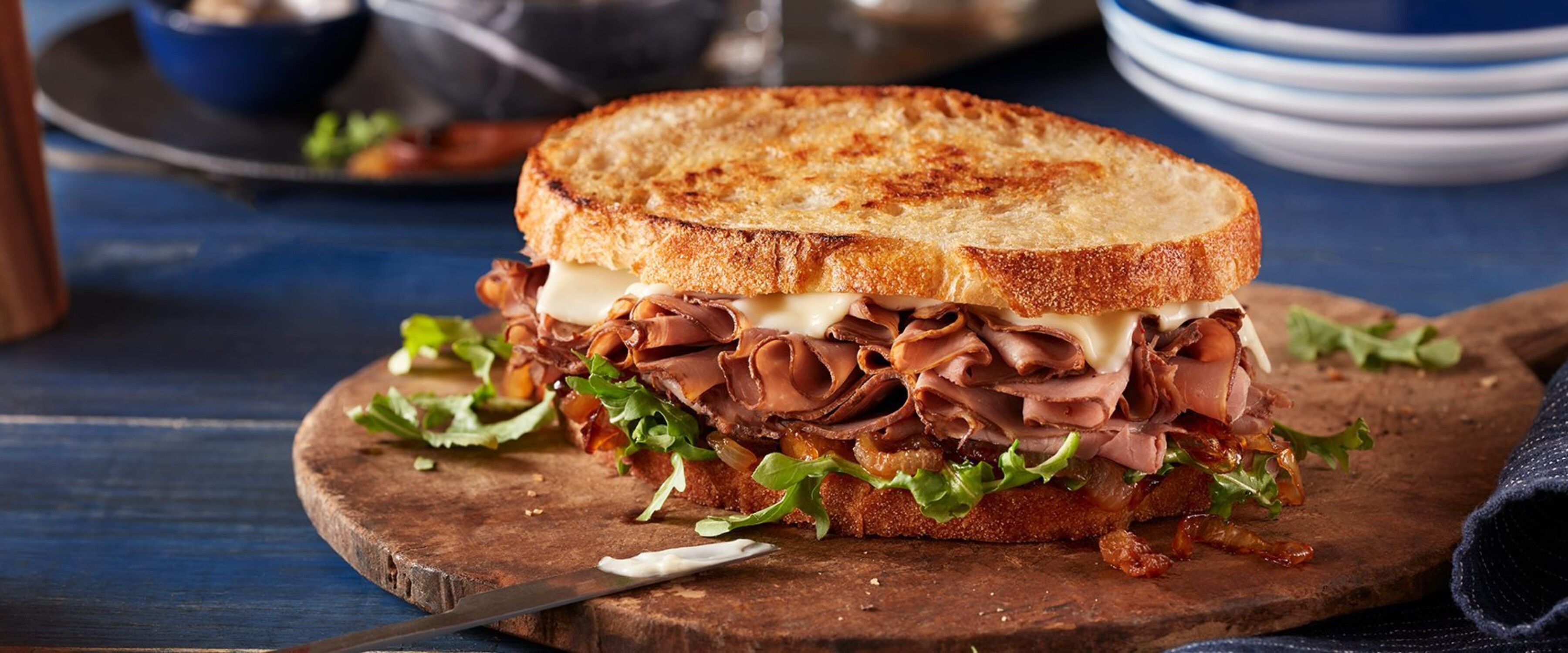 Grilled Roast Beef Sandwich With Caramelized Onions And Garlic Aioli Pillers